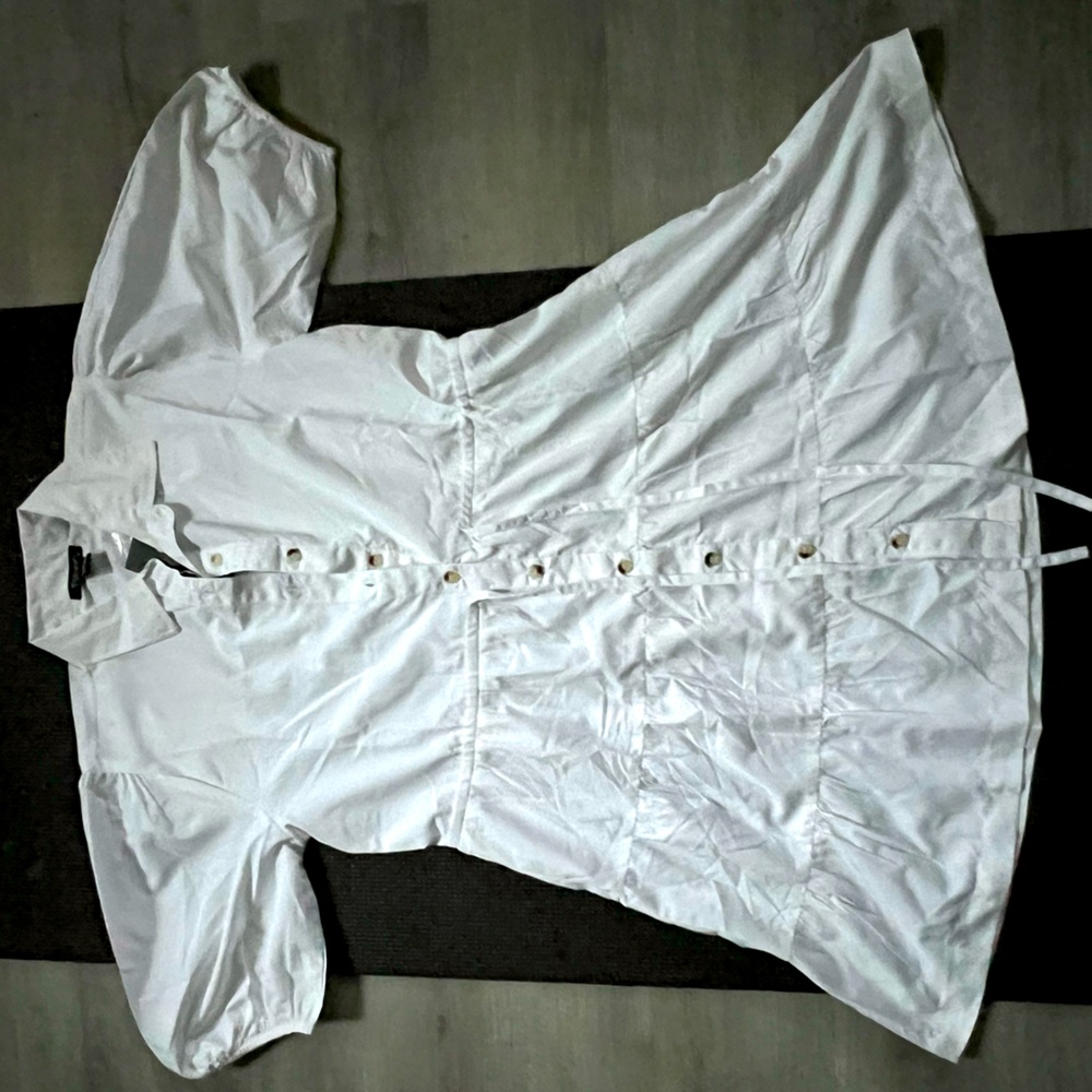 Cotton white shirt dress with bell sleep and buttons for cutest effect.